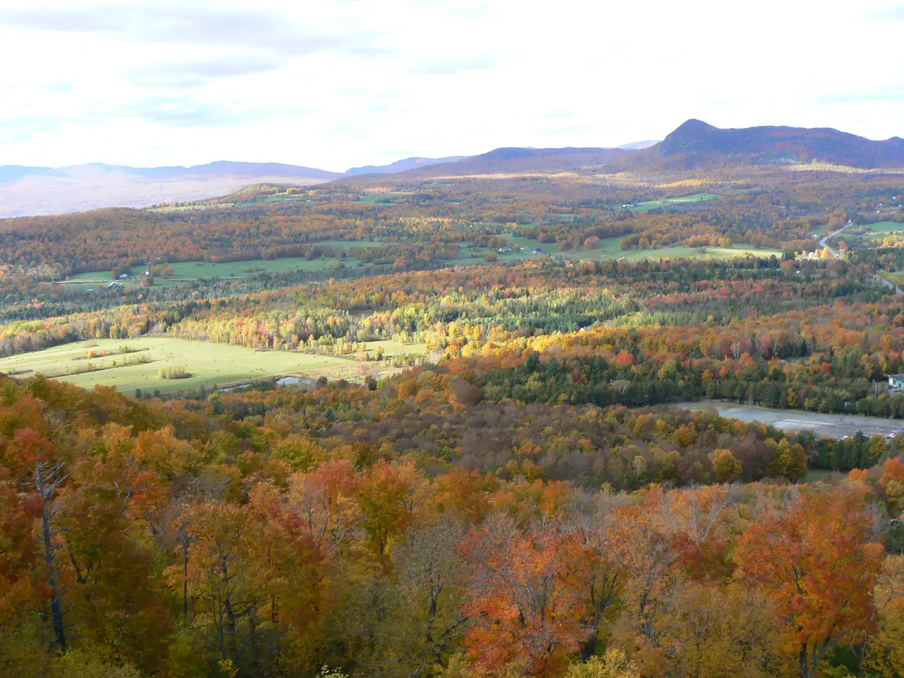Fall colours across the valley and distant hills seen from Owl's Head